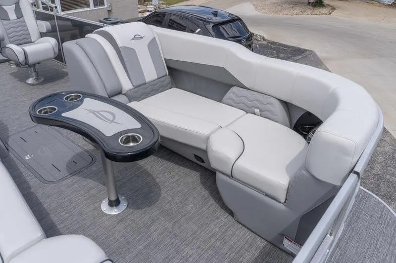 Slide: The Image of Luxurious seating on 2026 SunCatcher Elite 326 SL pontoon boat with stylish table and cup holders. - 15