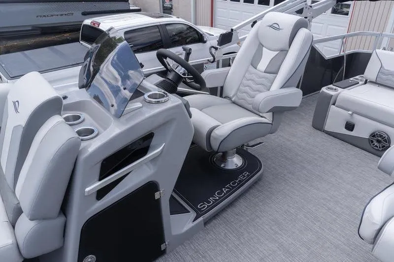 Slide: The Image of Luxurious interior of 2026 SunCatcher Elite 326 SL pontoon boat with plush seating. - 19