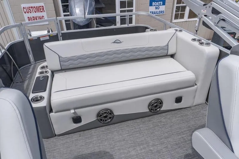 Slide: The Image of Luxury seating on 2026 SunCatcher Elite 326 SL boat, featuring cup holders and speakers. - 21