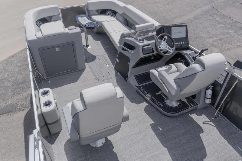 Slide: The Image of Luxurious interior of 2026 SunCatcher Elite 326 SL pontoon boat with modern seating and helm. - 4
