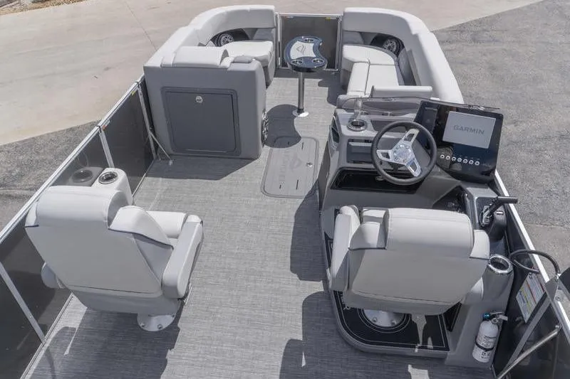 Slide: The Image of 2026 SunCatcher Elite 326 SL pontoon boat interior with modern seating and navigation system. - 5