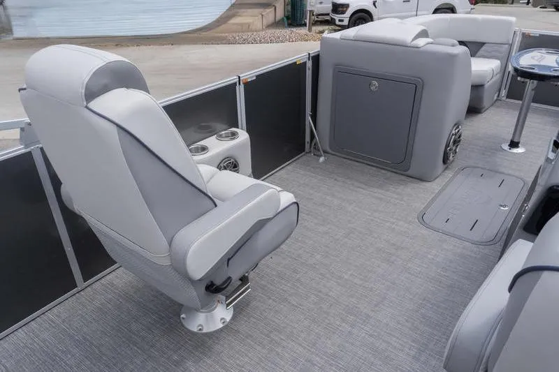 Slide: The Image of 2026 SunCatcher Elite 326 SL pontoon boat interior with gray seating and flooring. - 6