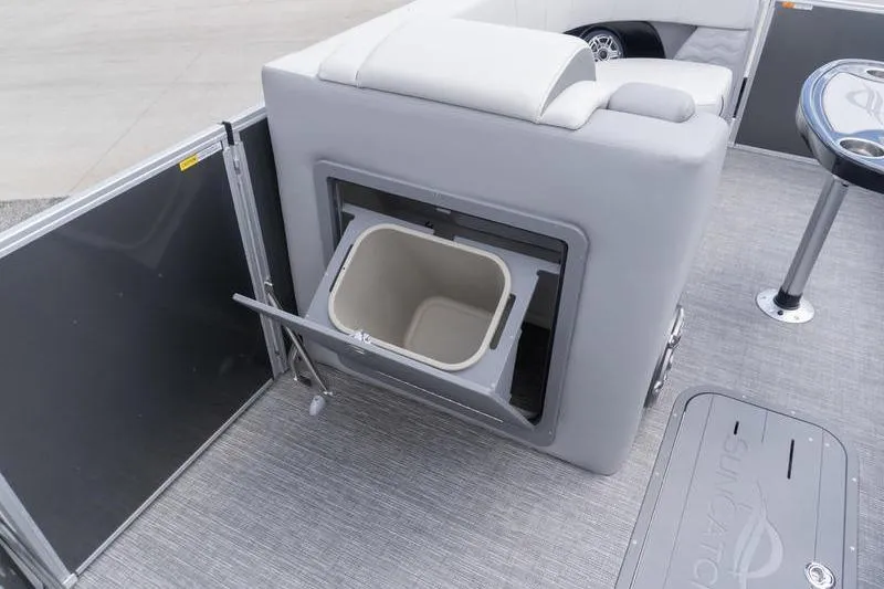 Slide: The Image of 2026 SunCatcher Elite 326 SL boat interior with built-in storage compartment and seating. - 7