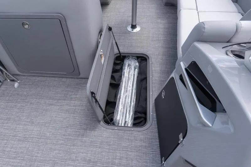 Slide: The Image of 2026 SunCatcher Elite 326 SL boat interior with open storage compartment. - 8