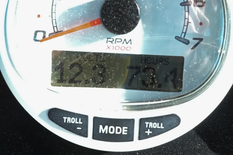 Slide: The Image of Boston Whaler 210 Outrage 2001 boat console with steering wheel and controls. - 4