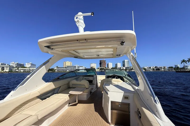 Slide: The Image of 2019 Regal 33 OBX luxury boat interior with city skyline and blue sky background. - 8