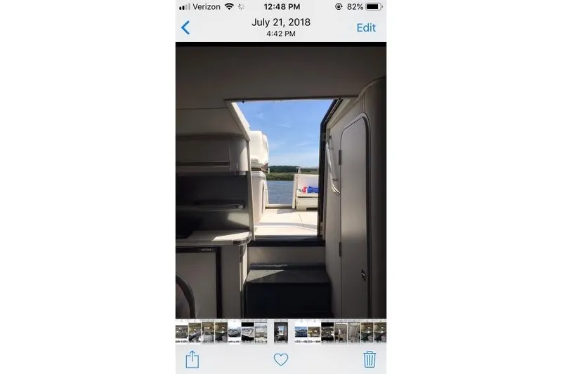 Slide: The Image of Interior view of 1989 Wellcraft 3200 St. Tropez yacht with open door to deck. - 13