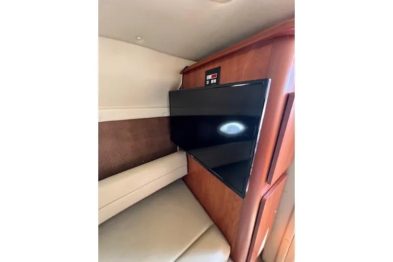 Slide: The Image of Interior of 2007 Rinker Fiesta Vee 250 with mounted flat-screen TV. - 8