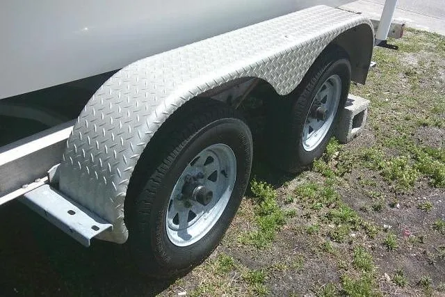 Slide: The Image of Trailer with dual wheels for 2008 NauticStar 2110 Nautic Bay boat. - 11