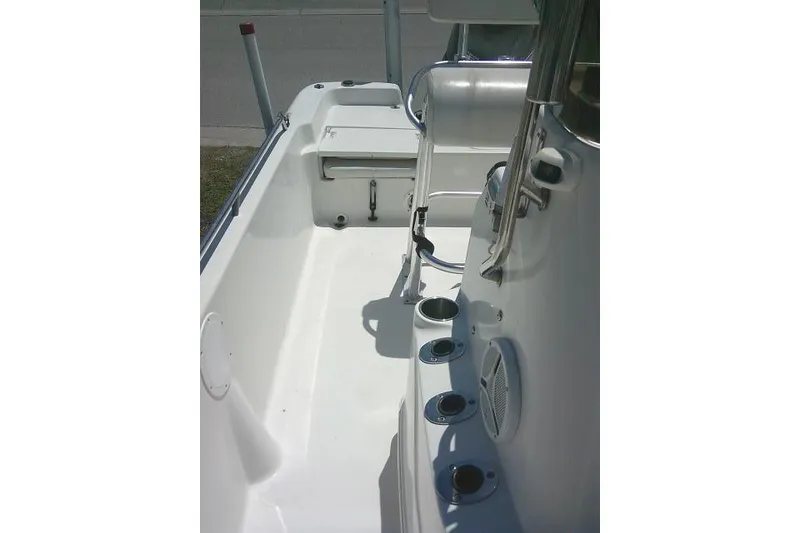 Slide: The Image of 2008 NauticStar 2110 Nautic Bay boat interior with rod holders and seating area. - 19