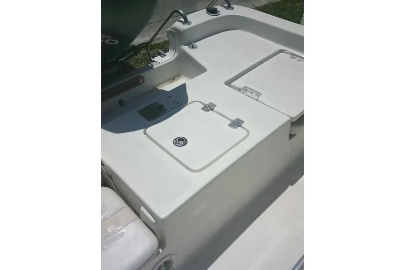Slide: The Image of 2008 NauticStar 2110 Nautic Bay boat deck with storage compartments. - 23