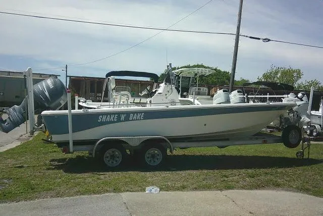 Slide: The Image of 2008 NauticStar 2110 Nautic Bay boat on trailer, labeled "Shake N' Bake." - 4