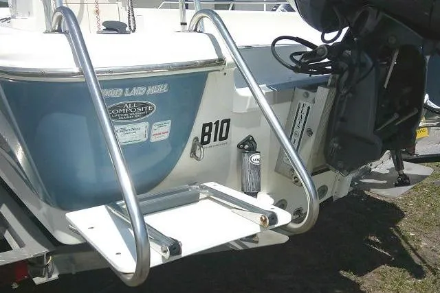 Slide: The Image of 2008 NauticStar 2110 Nautic Bay boat rear view with ladder and motor. - 8