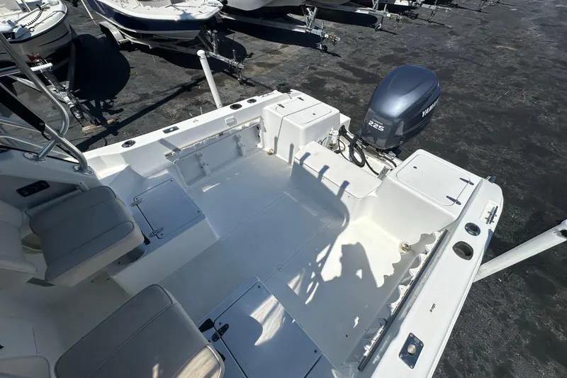 Slide: The Image of 2004 Sea Pro 220 Walk Around boat with Yamaha 225 engine, docked in a marina. - 10