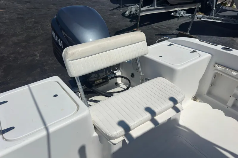 Slide: The Image of 2004 Sea Pro 220 Walk Around boat with Yamaha outboard motor and white seating. - 13