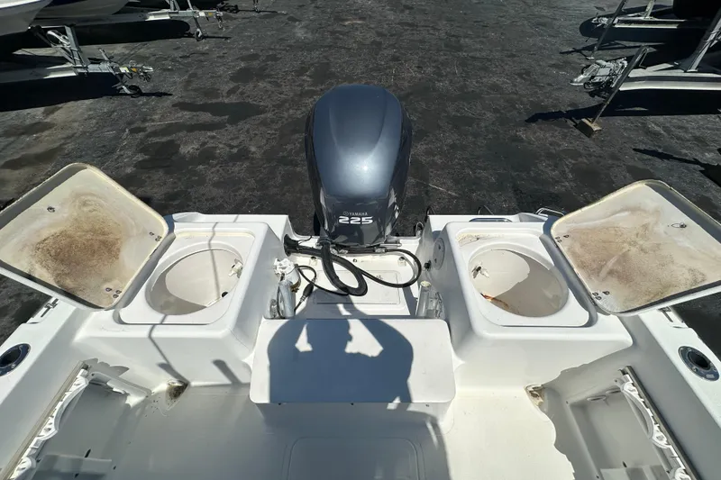 Slide: The Image of 2004 Sea Pro 220 Walk Around boat with Yamaha 225 engine, open storage compartments. - 14
