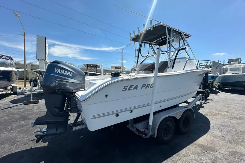 Slide: The Image of 2004 Sea Pro 220 Walk Around boat with Yamaha engine on trailer. - 2