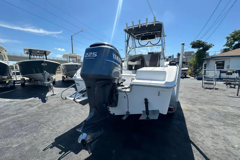 Slide: The Image of 2004 Sea Pro 220 Walk Around boat with Yamaha 225 engine, parked outdoors. - 3