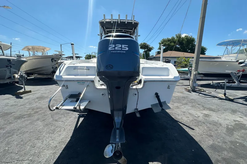 Slide: The Image of 2004 Sea Pro 220 Walk Around boat with 225 horsepower engine, parked outdoors. - 4