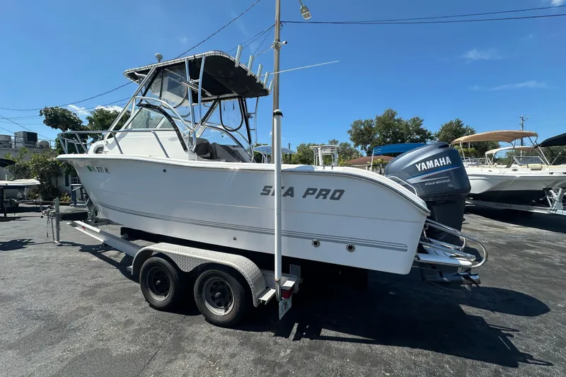Slide: The Image of 2004 Sea Pro 220 Walk Around boat on trailer with Yamaha outboard motor. - 6