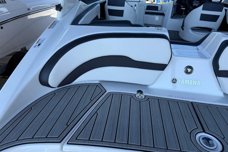 Slide: The Image of 2023 Yamaha Boats 195S interior with sleek seating and modern deck design. - 14