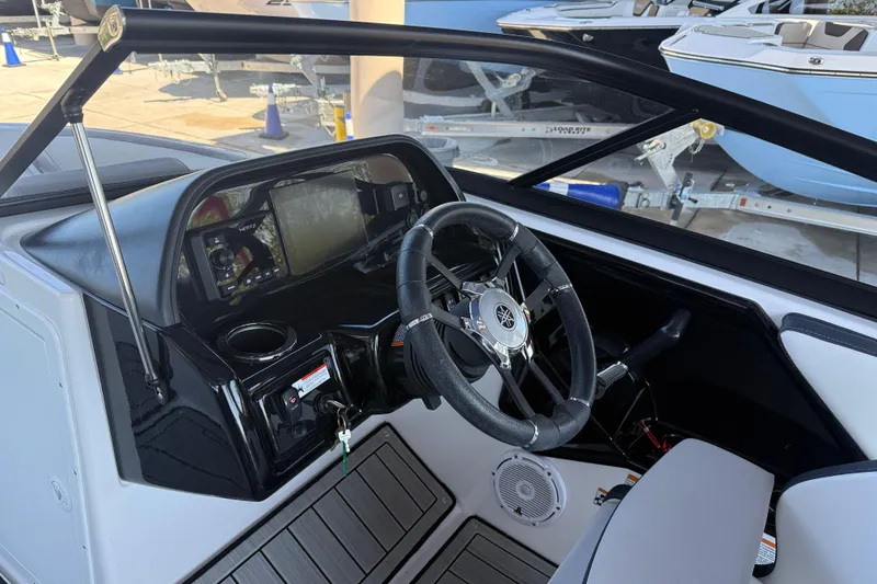 Slide: The Image of 2023 Yamaha Boats 195S dashboard with steering wheel and control panel. - 19