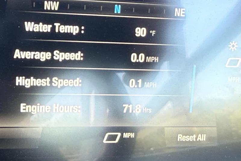 Slide: The Image of Dashboard of 2023 Yamaha Boats 195S showing water temperature and engine hours. - 21