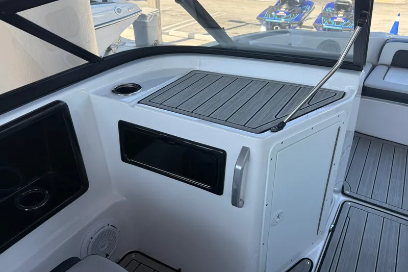 Slide: The Image of Interior view of 2023 Yamaha Boats 195S, featuring sleek design and storage compartments. - 23