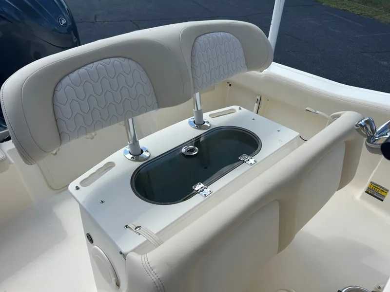 Slide: The Image of The 2027 Scout 195 Sportfish features a cushioned bench seat with integrated storage. - 29