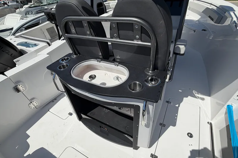 Slide: The Image of Interior view of 2026 Sea Pro 262 DLX with seating and sink area. - 12