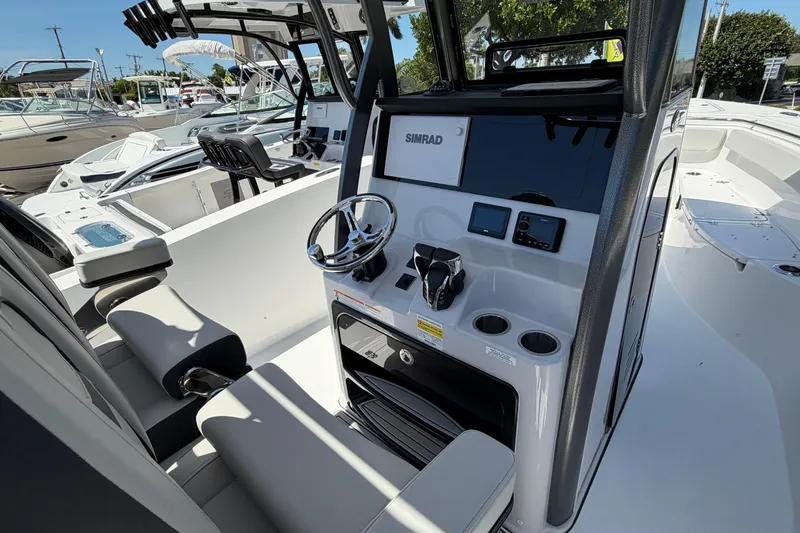 Slide: The Image of Interior view of 2026 Sea Pro 262 DLX with modern helm console. - 13