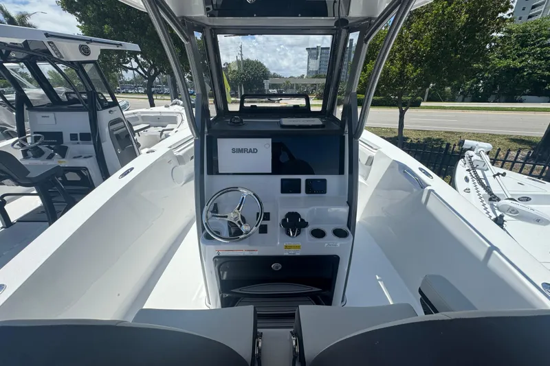Slide: The Image of Interior view of 2026 Sea Pro 262 DLX with helm console. - 16