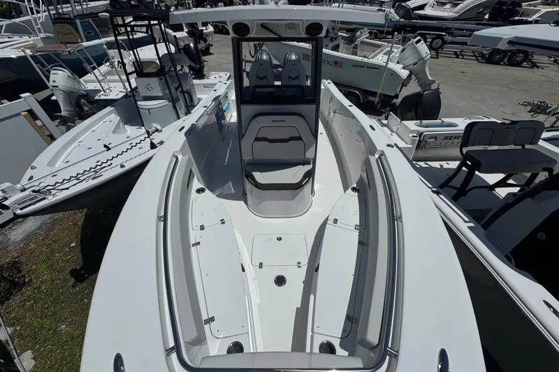 Slide: The Image of 2026 Sea Pro 262 DLX boat in a parking lot. - 20