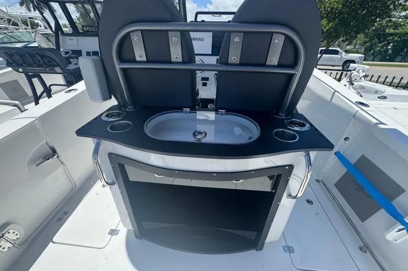 Slide: The Image of Interior view of 2026 Sea Pro 262 DLX with sink and storage. - 25
