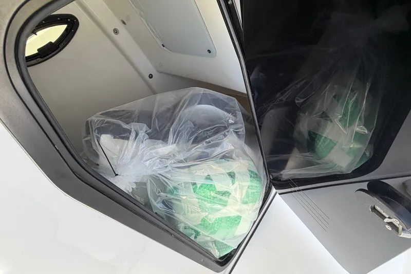 Slide: The Image of Interior of Sea Pro 262 DLX 2026 with packaged accessories. - 27