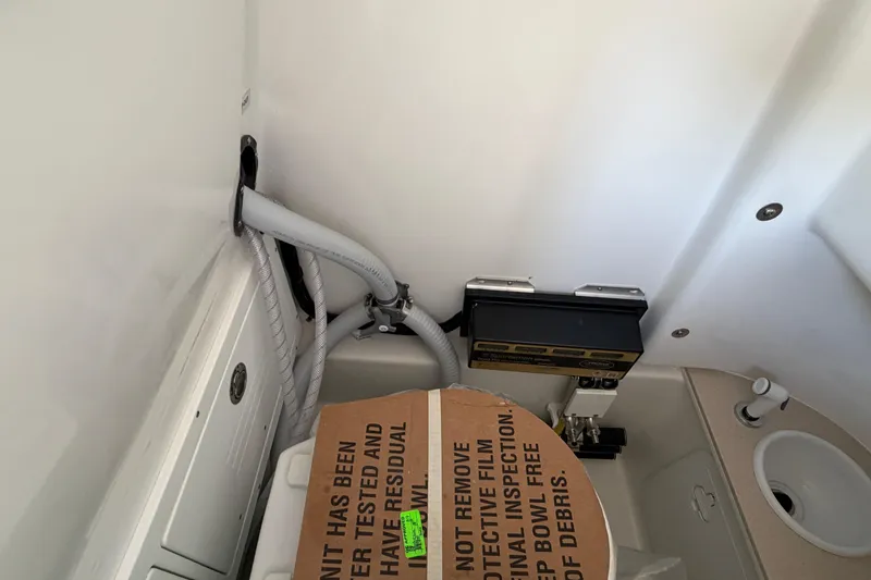 Slide: The Image of Interior of Sea Pro 262 DLX 2026 with plumbing installation. - 28