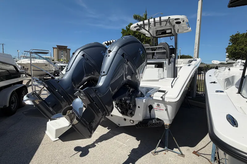 Slide: The Image of 2026 Sea Pro 262 DLX boat with dual engines at the dock. - 3