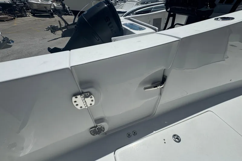 Slide: The Image of 2026 Sea Pro 262 DLX boat with engine and deck details. - 35