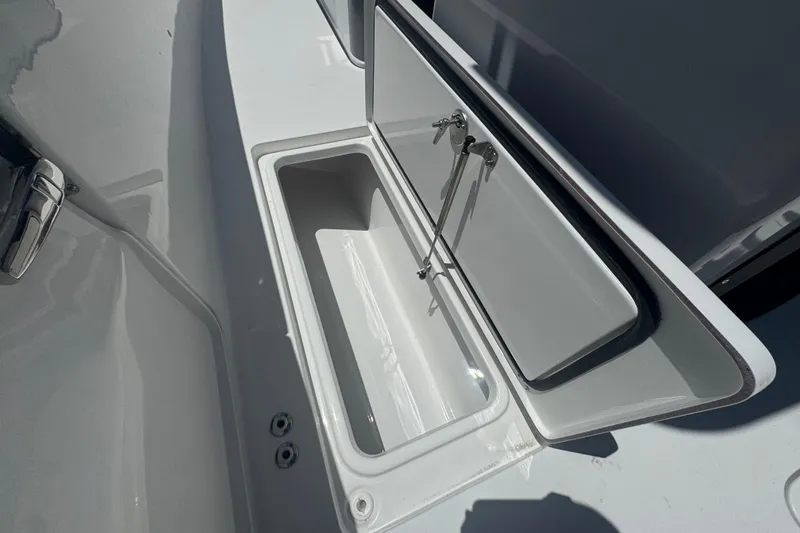Slide: The Image of Open storage compartment on a 2026 Sea Pro 262 DLX boat. - 36