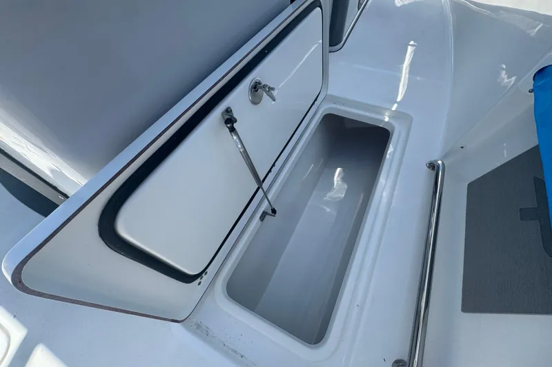 Slide: The Image of 2026 Sea Pro 262 DLX boat with open storage compartment. - 37