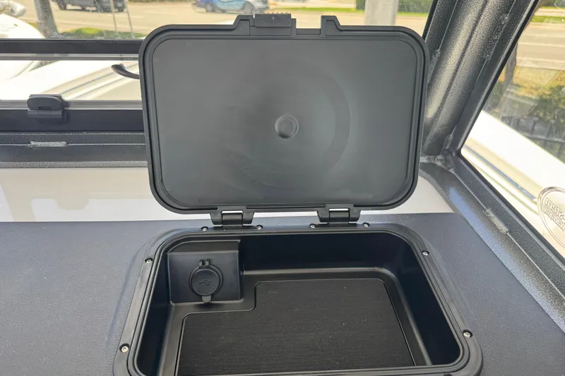Slide: The Image of Open storage compartment on a 2026 Sea Pro 262 DLX boat. - 42