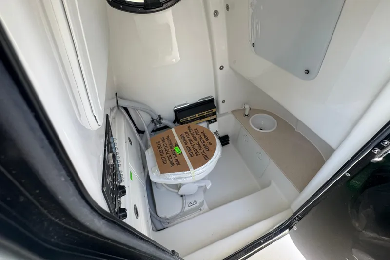 Slide: The Image of Interior of 2026 Sea Pro 262 DLX featuring toilet and sink. - 45