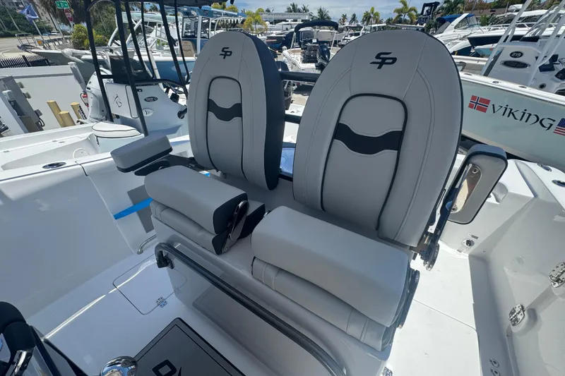 Slide: The Image of Interior of 2026 Sea Pro 262 DLX featuring luxurious seating. - 7
