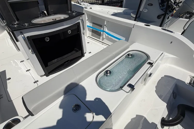 Slide: The Image of Interior view of 2026 Sea Pro 262 DLX with seating and storage. - 8