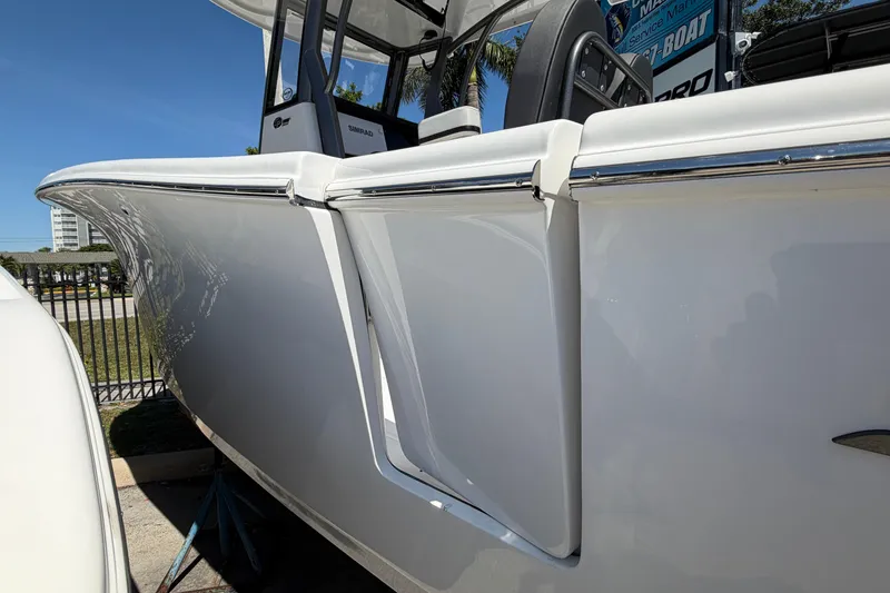 Slide: The Image of 2026 Sea Pro 262 DLX boat, side view outdoors. - 9