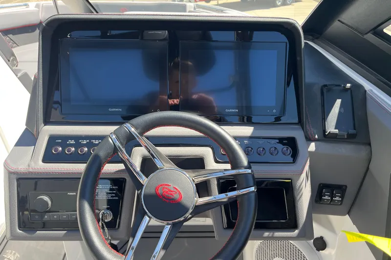Slide: The Image of 2023 Cobalt R8 Surf dashboard with dual Garmin displays and modern steering wheel. - 10