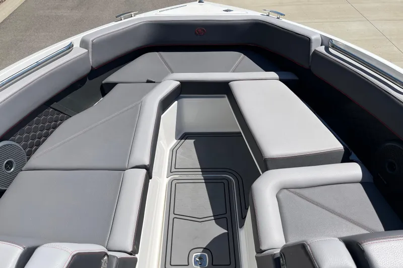 Slide: The Image of Luxurious seating area on a 2023 Cobalt R8 Surf boat, featuring sleek gray upholstery. - 12