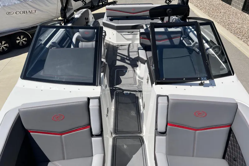 Slide: The Image of 2023 Cobalt R8 Surf boat interior with sleek seating and modern design. - 13