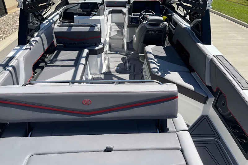 Slide: The Image of 2023 Cobalt R8 Surf boat interior with sleek gray seating and modern dashboard. - 8