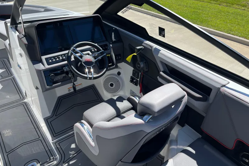 Slide: The Image of 2023 Cobalt R8 Surf boat interior with modern dashboard and steering wheel. - 9